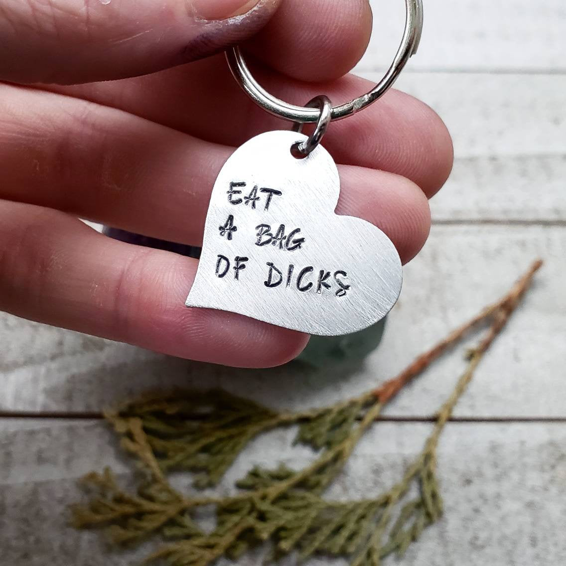 Eat a bag of d*cks Keychain